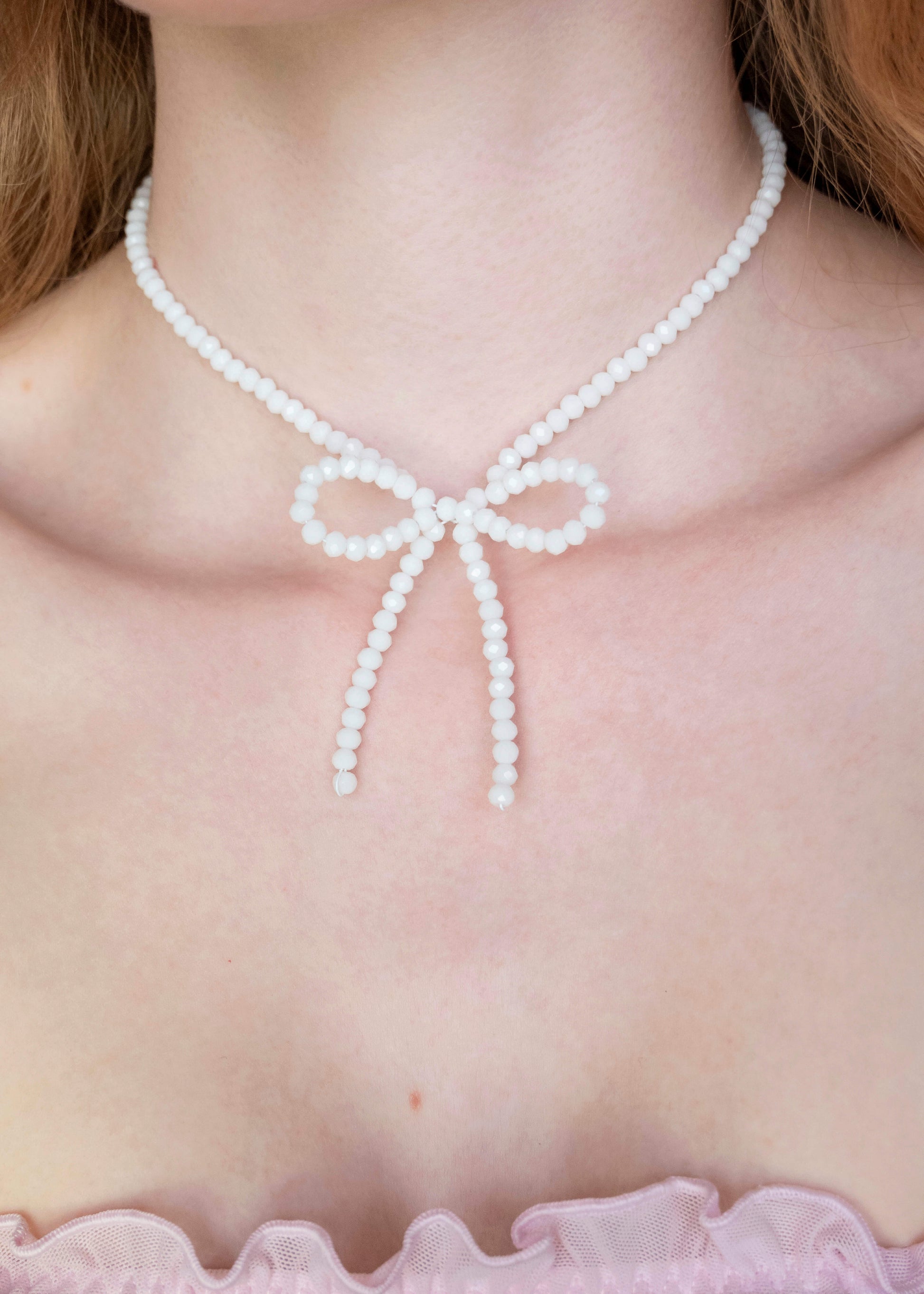 white bow necklace