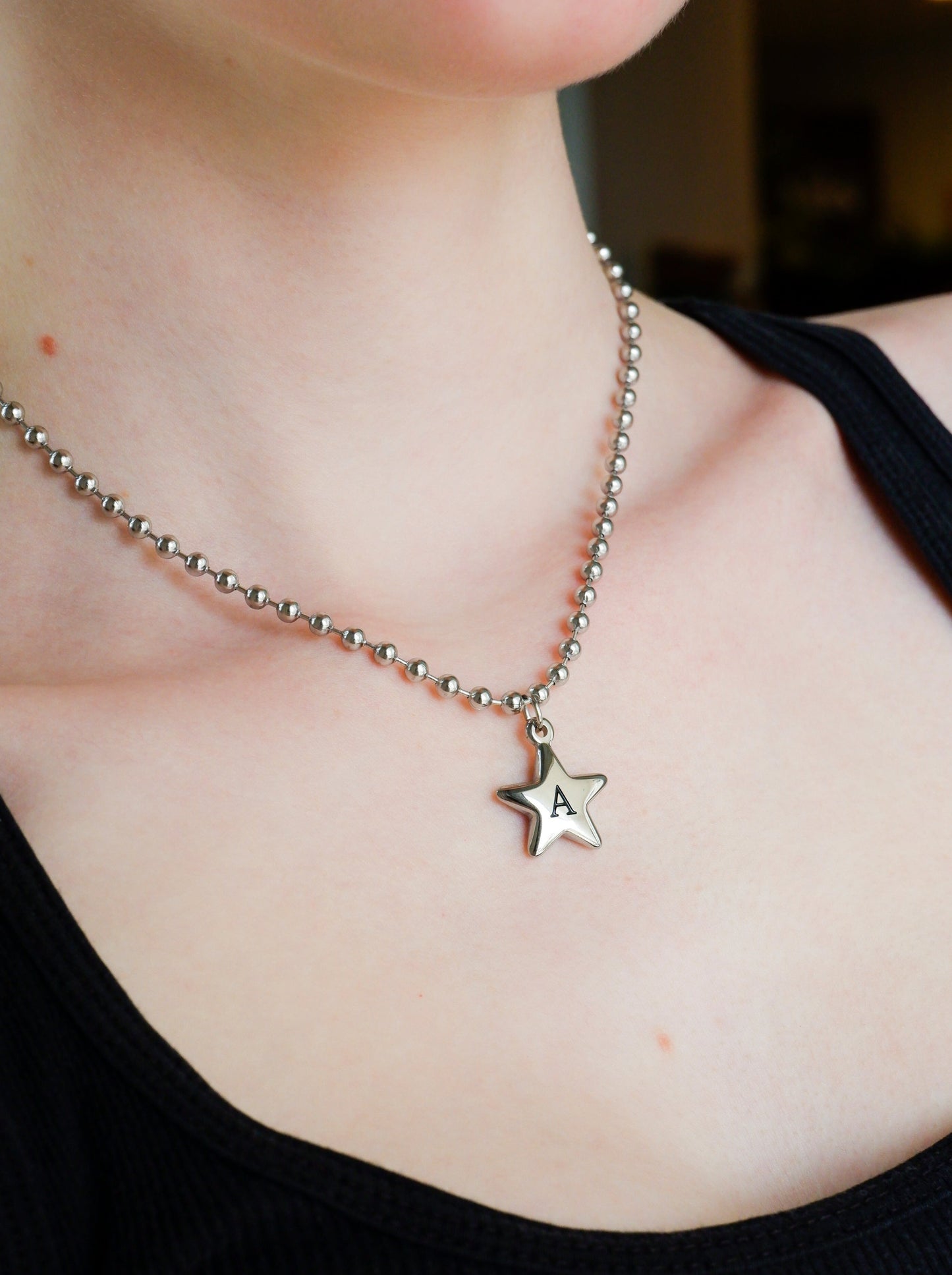 star initial necklace on a stainless steel ball chain