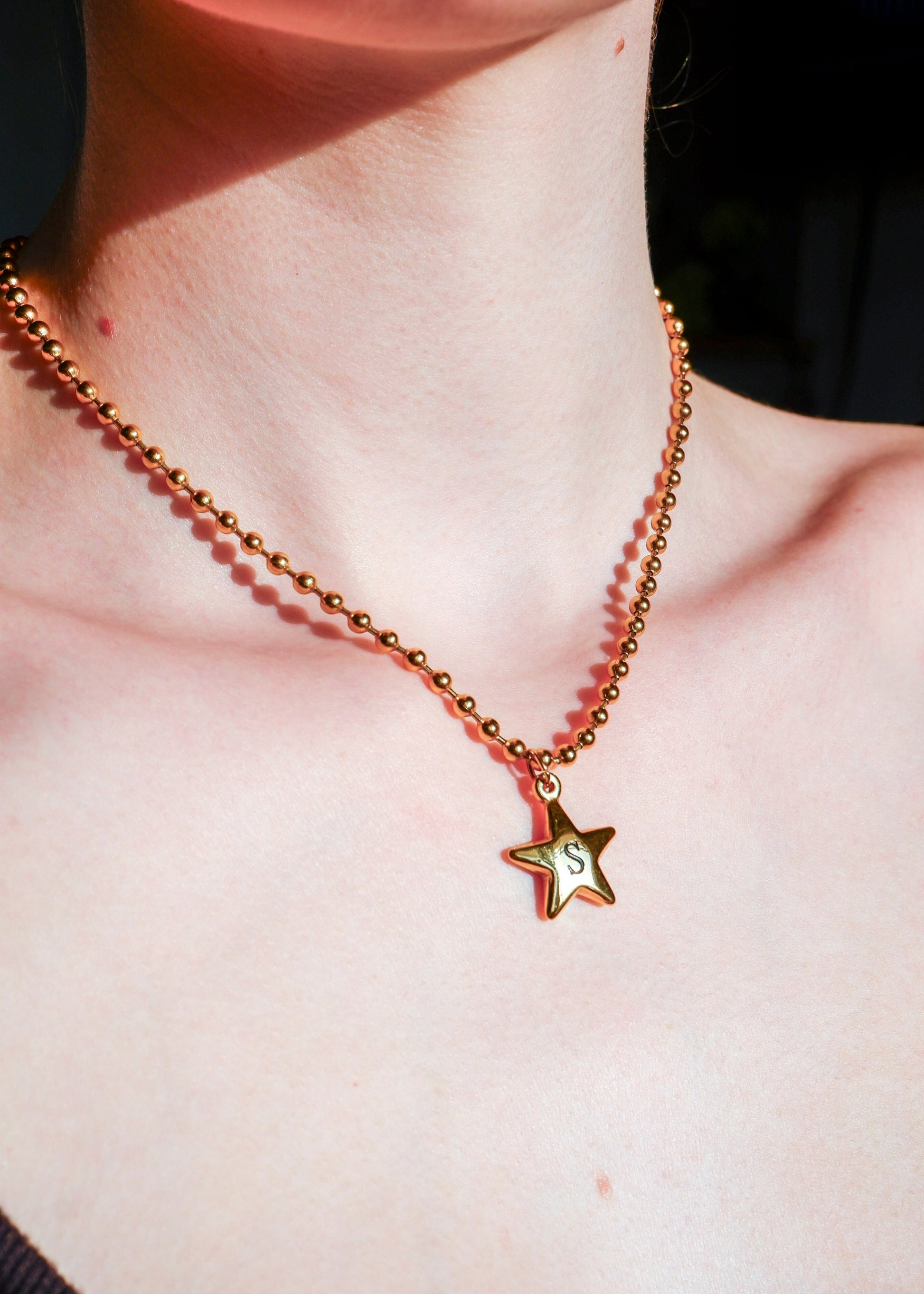 gold initial star necklace on a ball chain