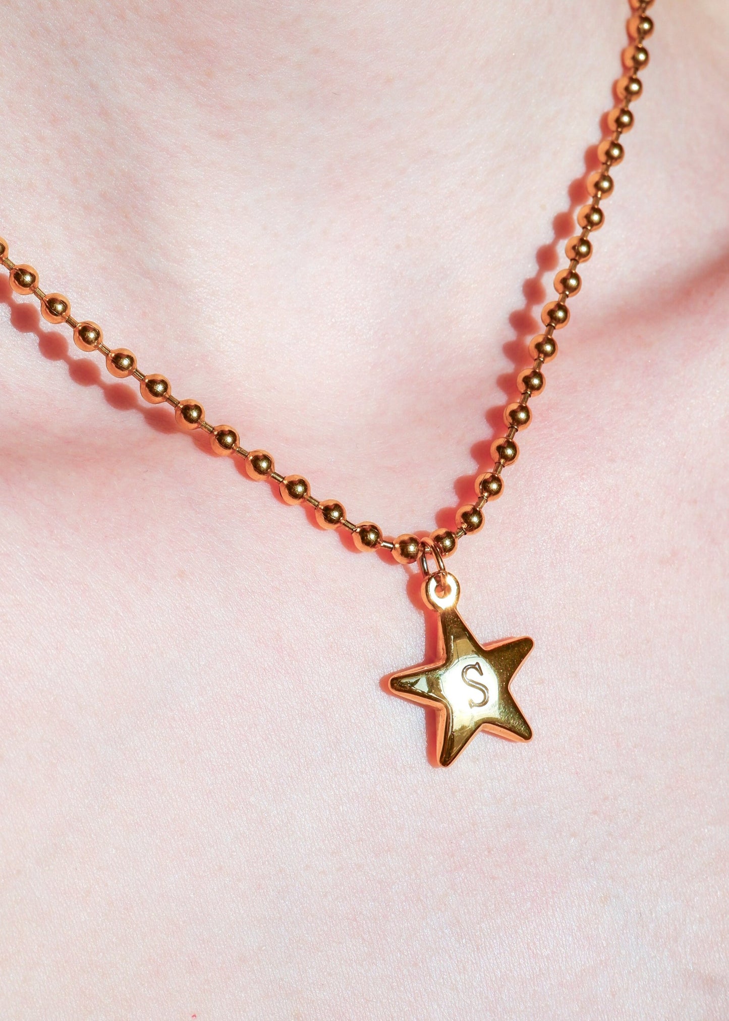 gold initial star necklace on a ball chain