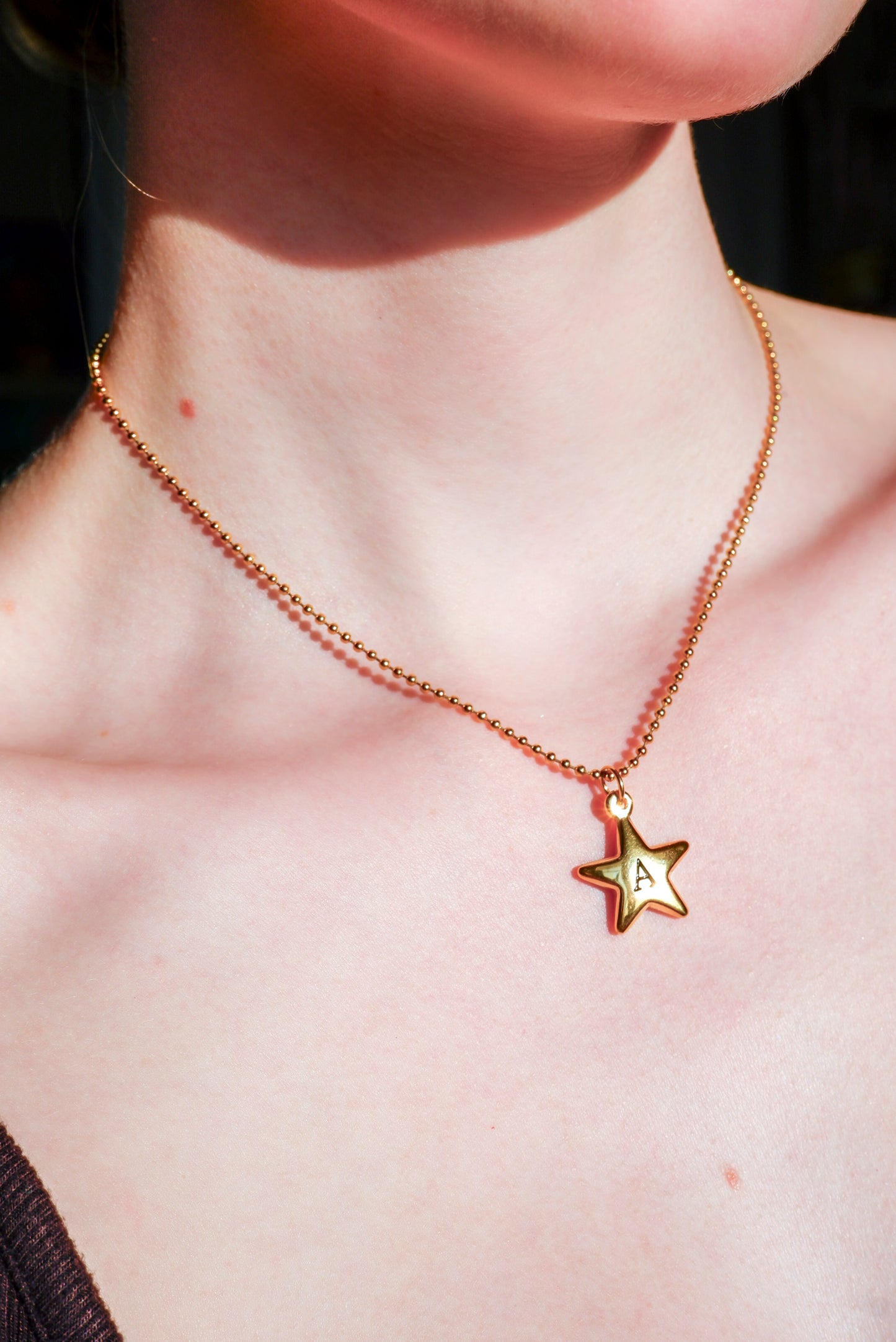 gold initial star necklace on a ball chain